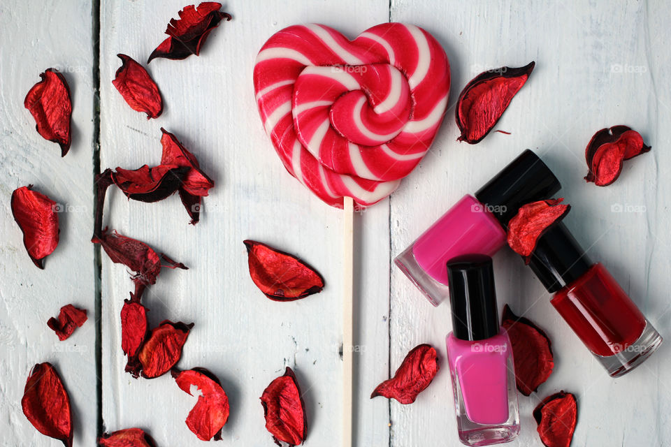 Beauty, health, spa and personal care: nail polish, flowers, rose petals, sweet