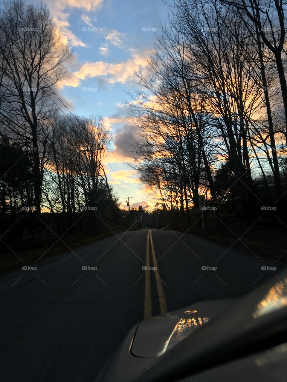 Long open road ahead with beautiful sunset. Wonder what adventures await me and can’t wait!