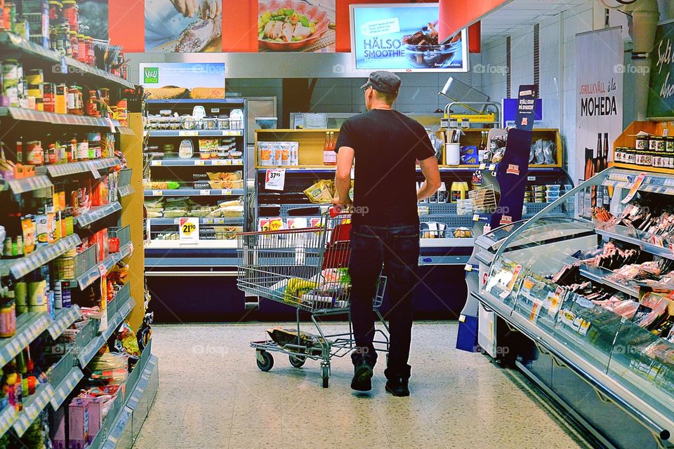 Man shopping in a supermarket