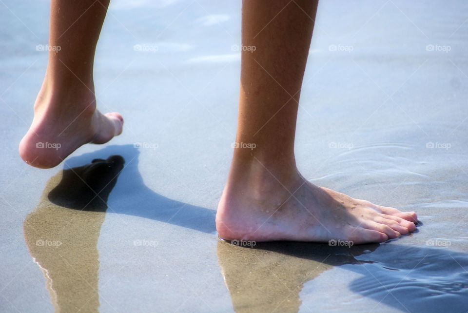 Human feet on beach