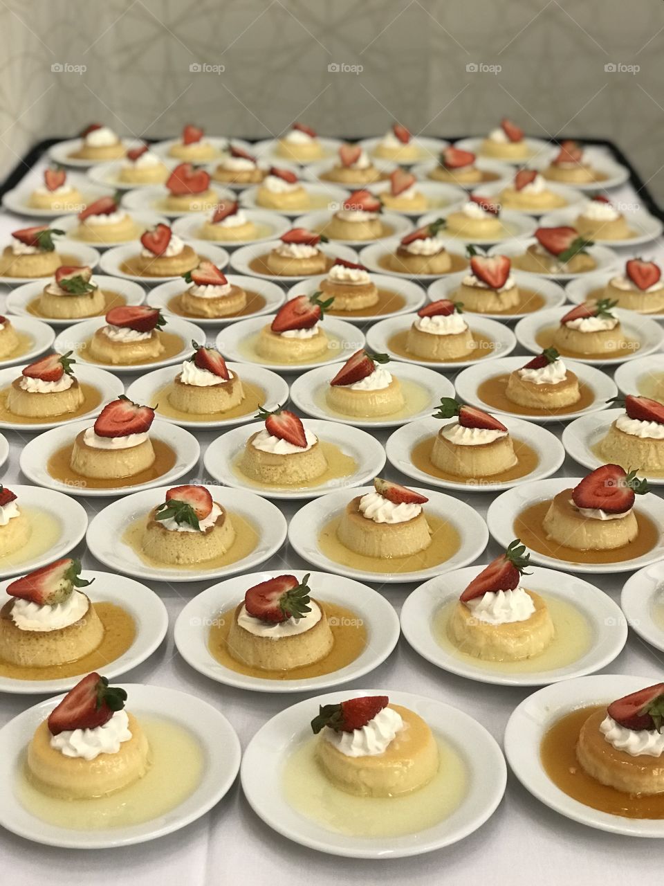 Dessert table!  Flan with strawberry and whipped cream topping.  A feast for the palate.
