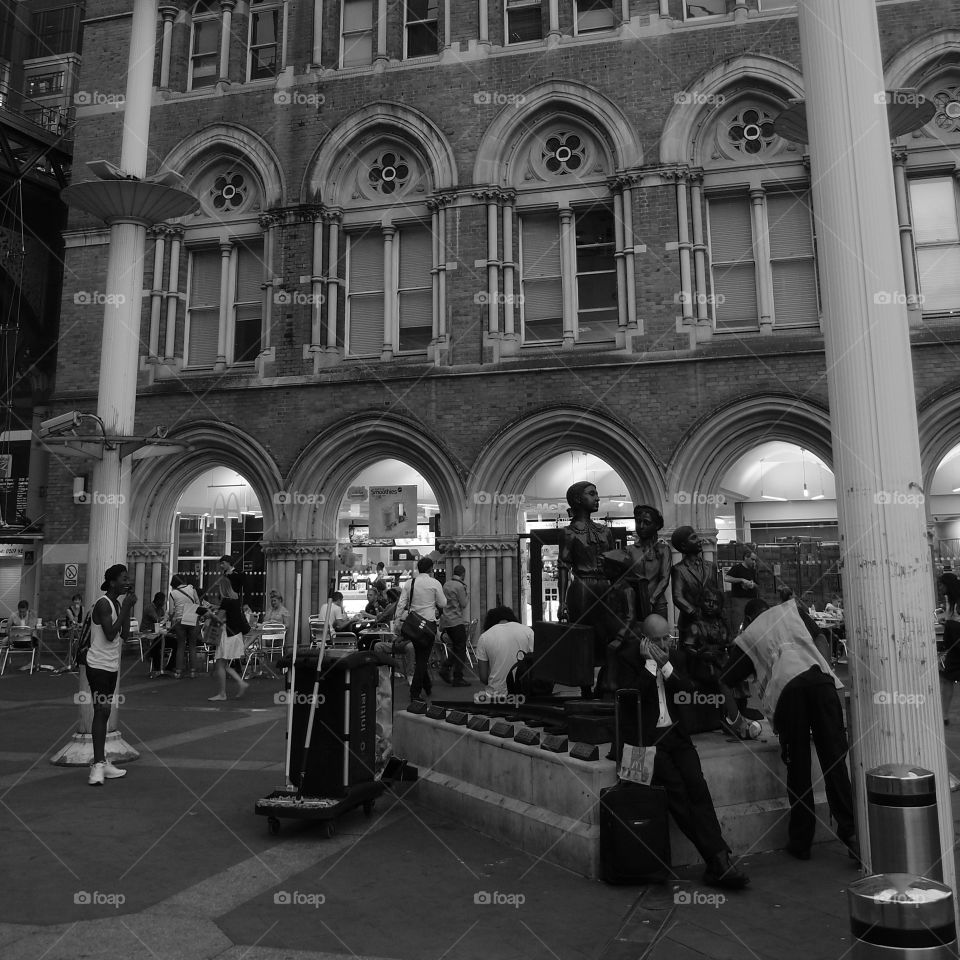 People playing music, walking, shopping and enjoying themselves in London on a sunny summer day. 