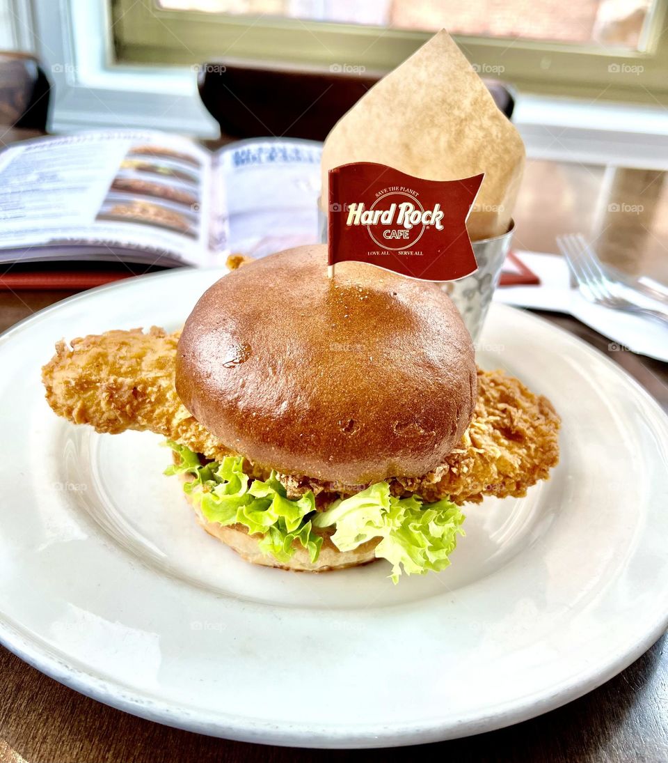 Appetizing burger with chicken cutlet and potatoes