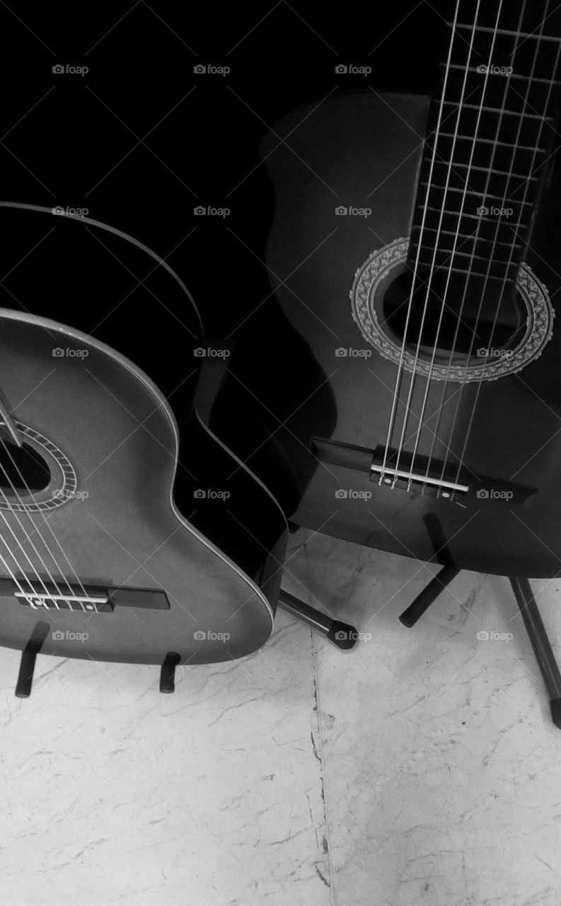 Two black wooden quitars in closeup#
instrument#music#sound#solfegium#
rock#acoustic#chord