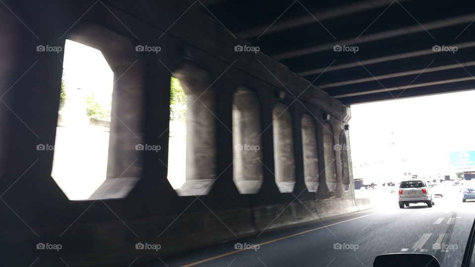 a wall. a wall under a bridge