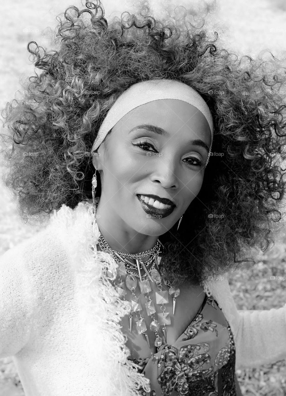 black and white portrait of a beautiful woman smiling