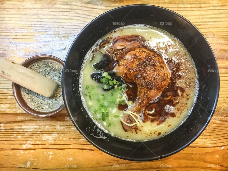 Chicken ramen with sesame seeds in the side