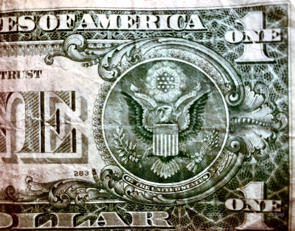 Old used dollar bill. Folded many times in many different wallets and cash drawers. Shot close up and done in sharp detail. 