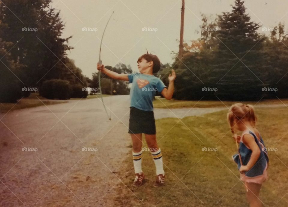 Superman learns archery. This is an old photo of me, shooting a bow and arrow...
