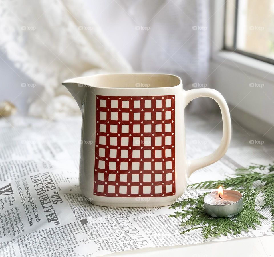 Vintage water jug with red geometric pattern 