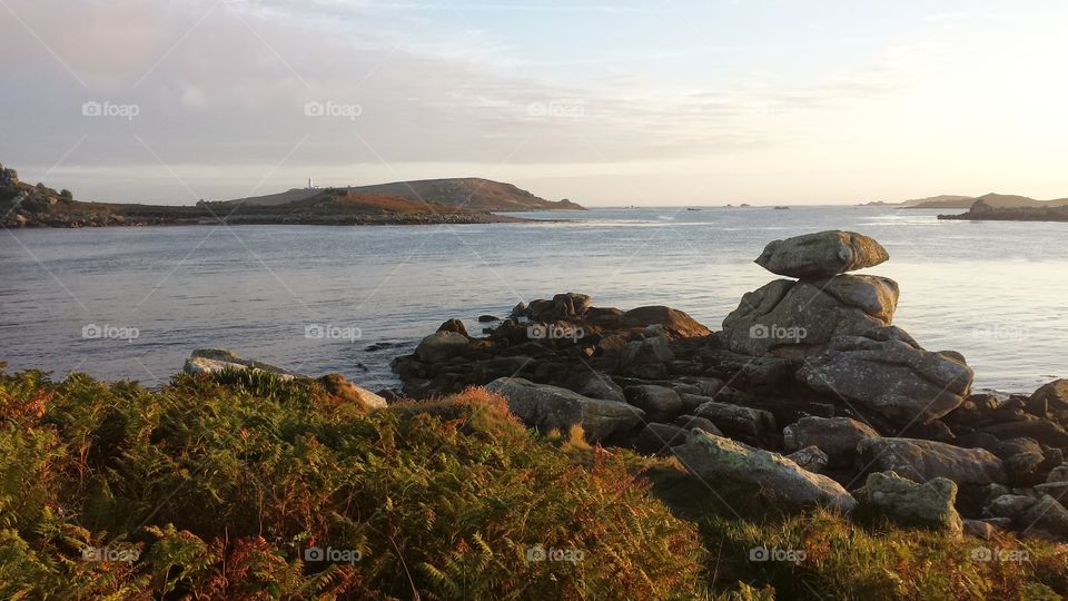 sunlight on Rocky shore of sea