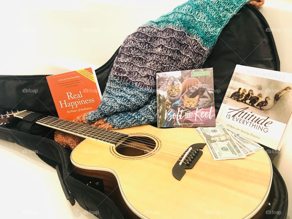 Let’s get ready to travel with best guitar, favorite feel good reads, a little cash, and best scarf! 