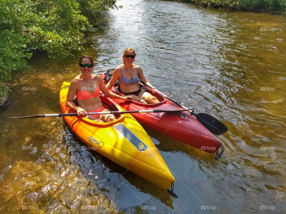 girlfriends in bikinis kayaking