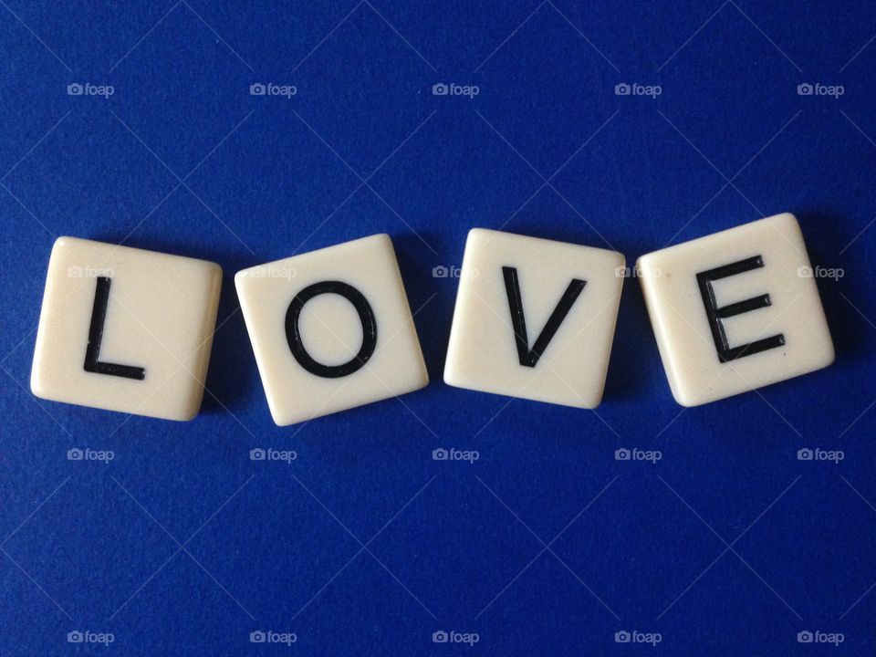 Love . Word love made with letter tiles