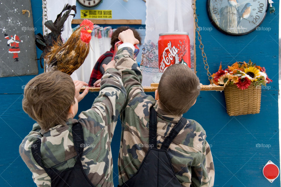 Two boys purchase a Coke at the Bobhouse vendor at the fishing derby