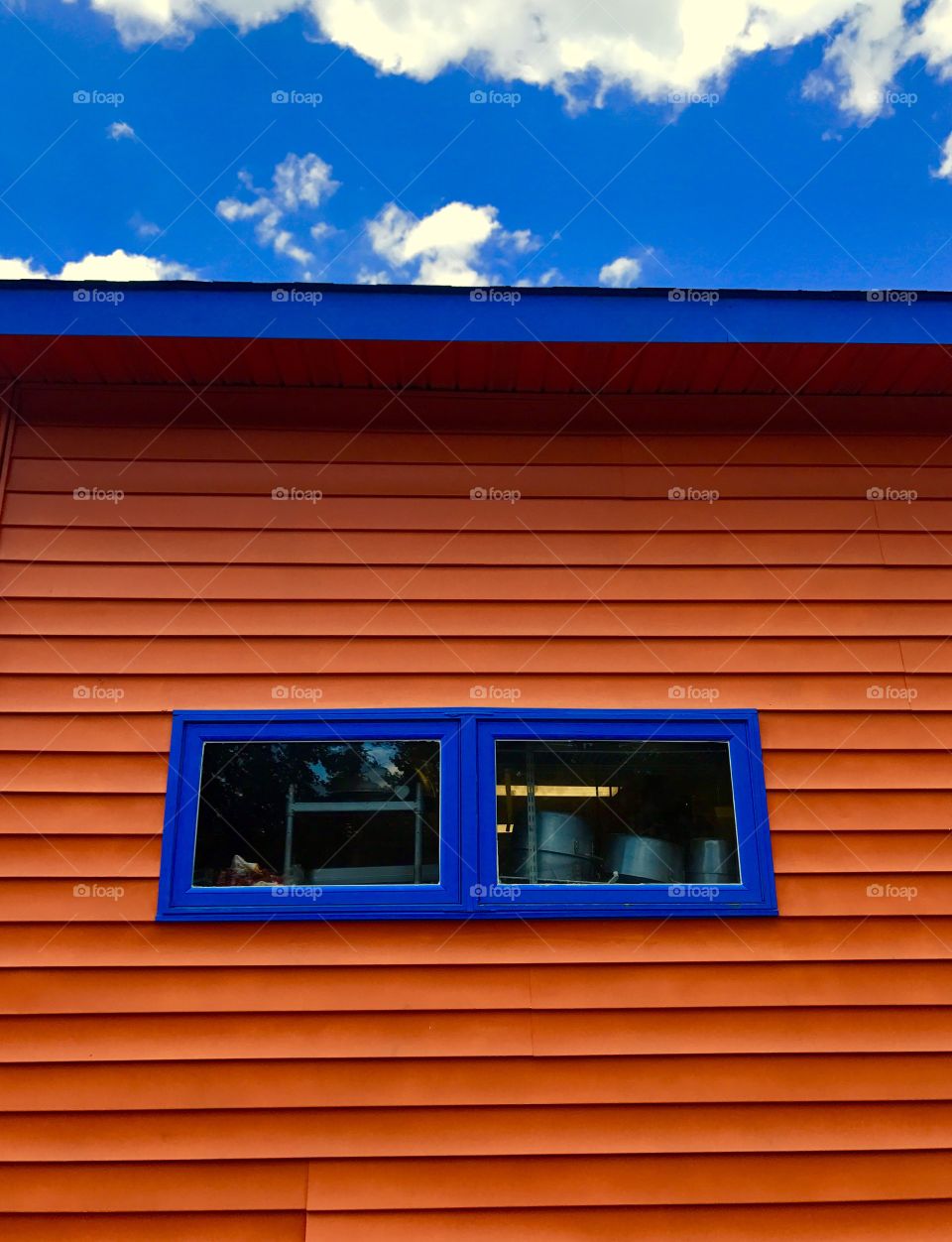 Orange Siding Blue Window