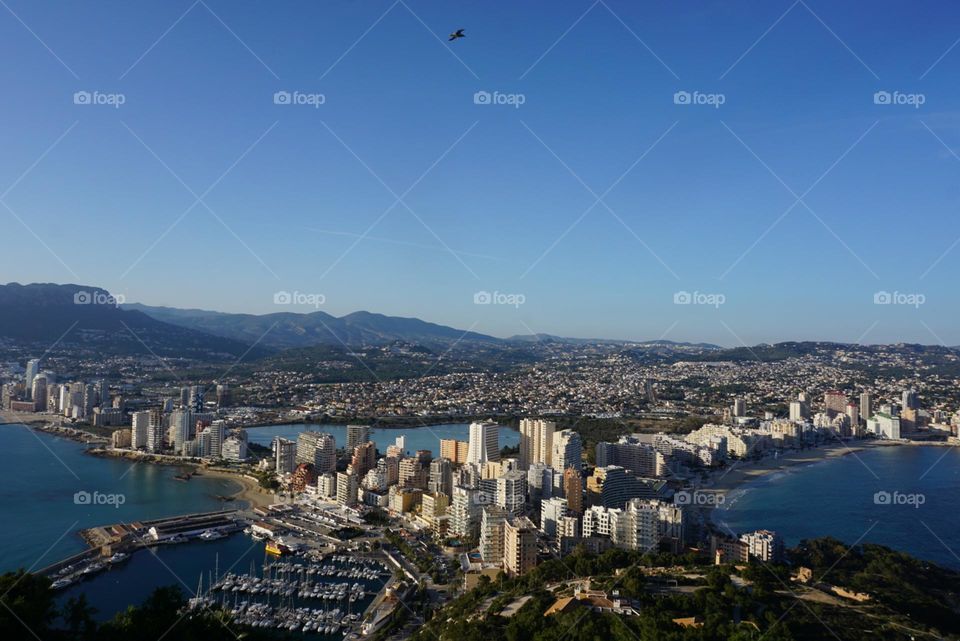 Seaview#buildings#mountains#sky#water#city