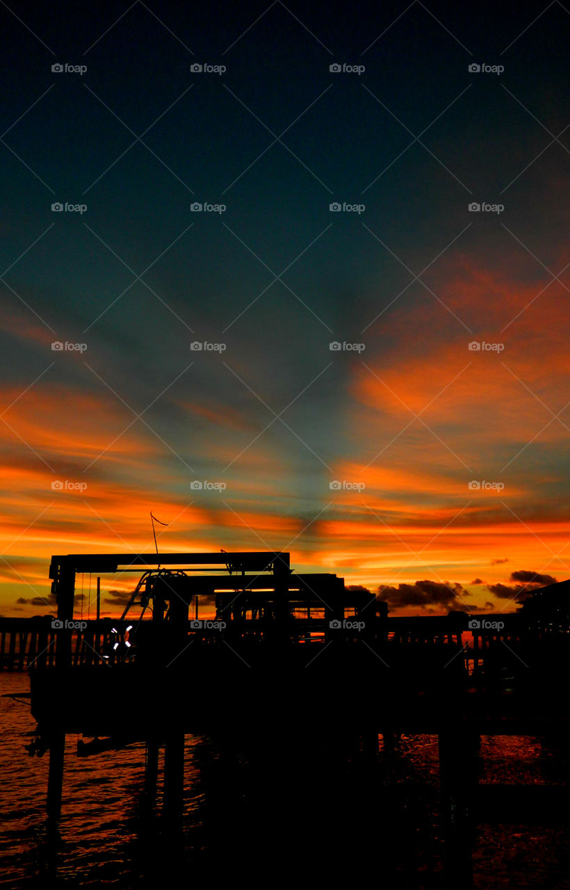 Silhouette of machinery at sea