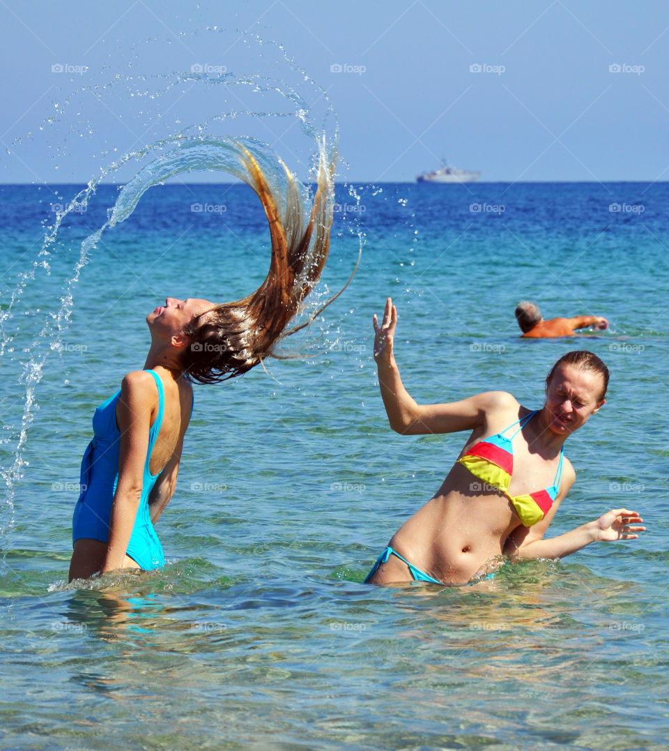 Having fun on Sardinia Nora beach Mediterranean Sea 