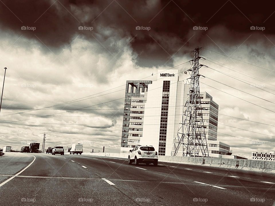 Cloudy skies over a city highway 