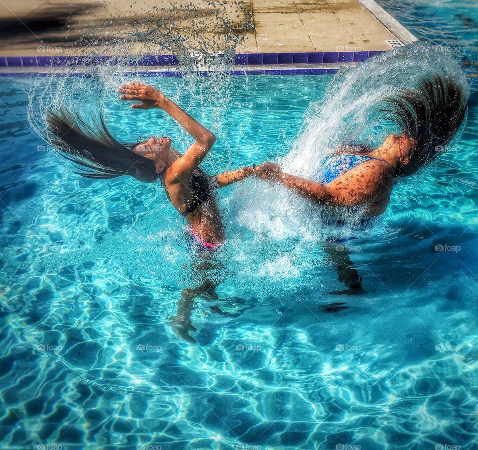 My Aunt and I flipping our hair in the water 