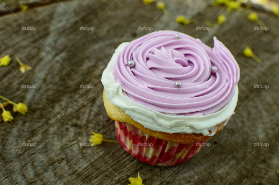 Closeup of cupcake on wood 