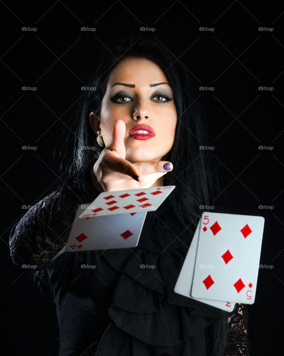 Woman Throwing Playing Cards
