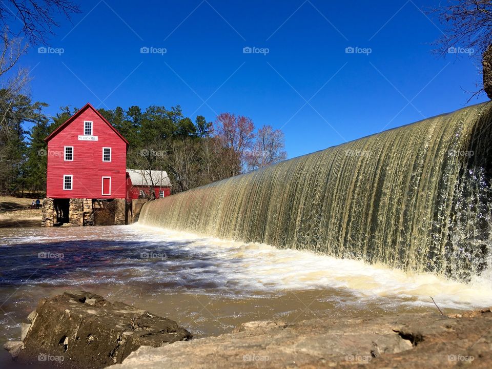 Red mill and waterfall