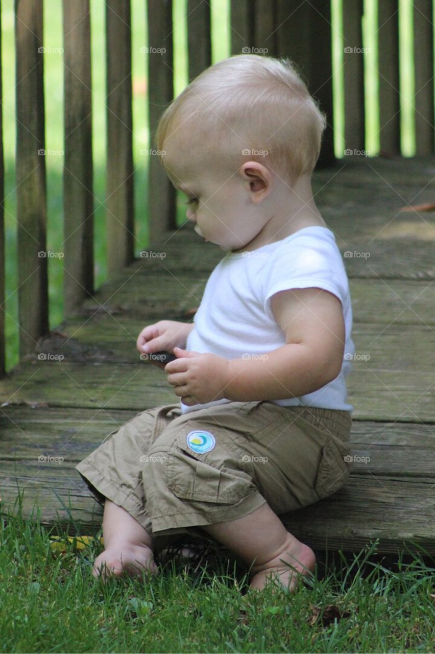 Little boy playing in garden