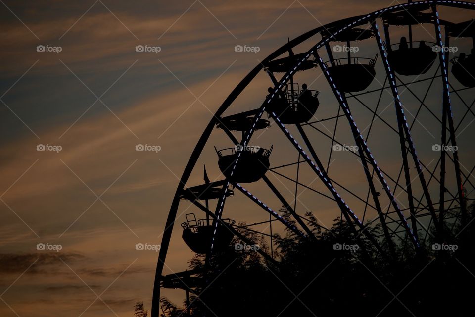 Low angle view of silhouette ferris wheel