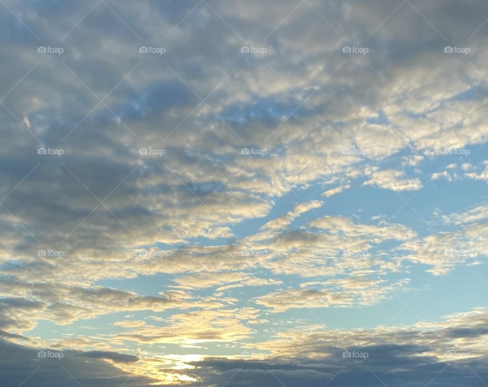 Nice early sunset with clouds in the blue sky