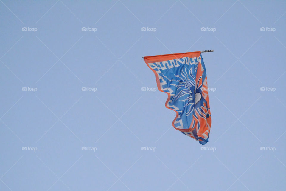 Flying flag (the flag waver is not in the framing) - Cadorago, Como, Italy.