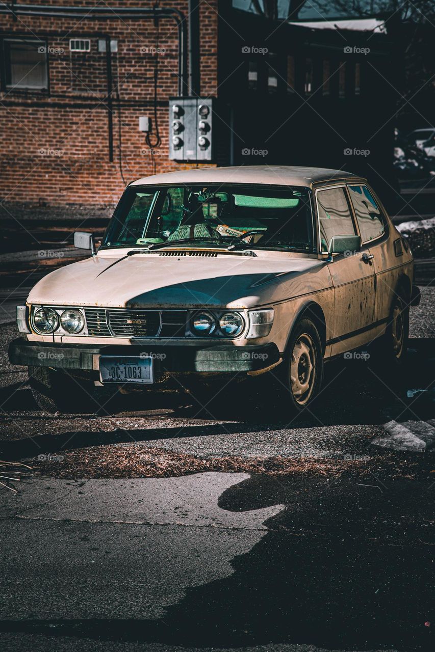 Desolate alley and car.