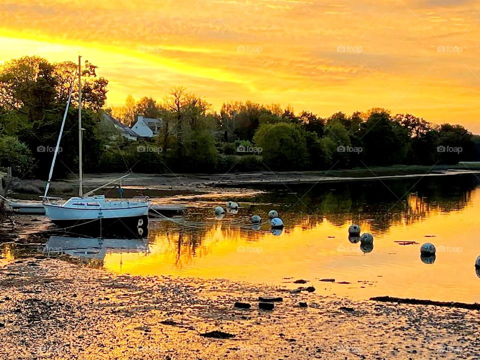 Sunset on a sailing ship at Cap Coz