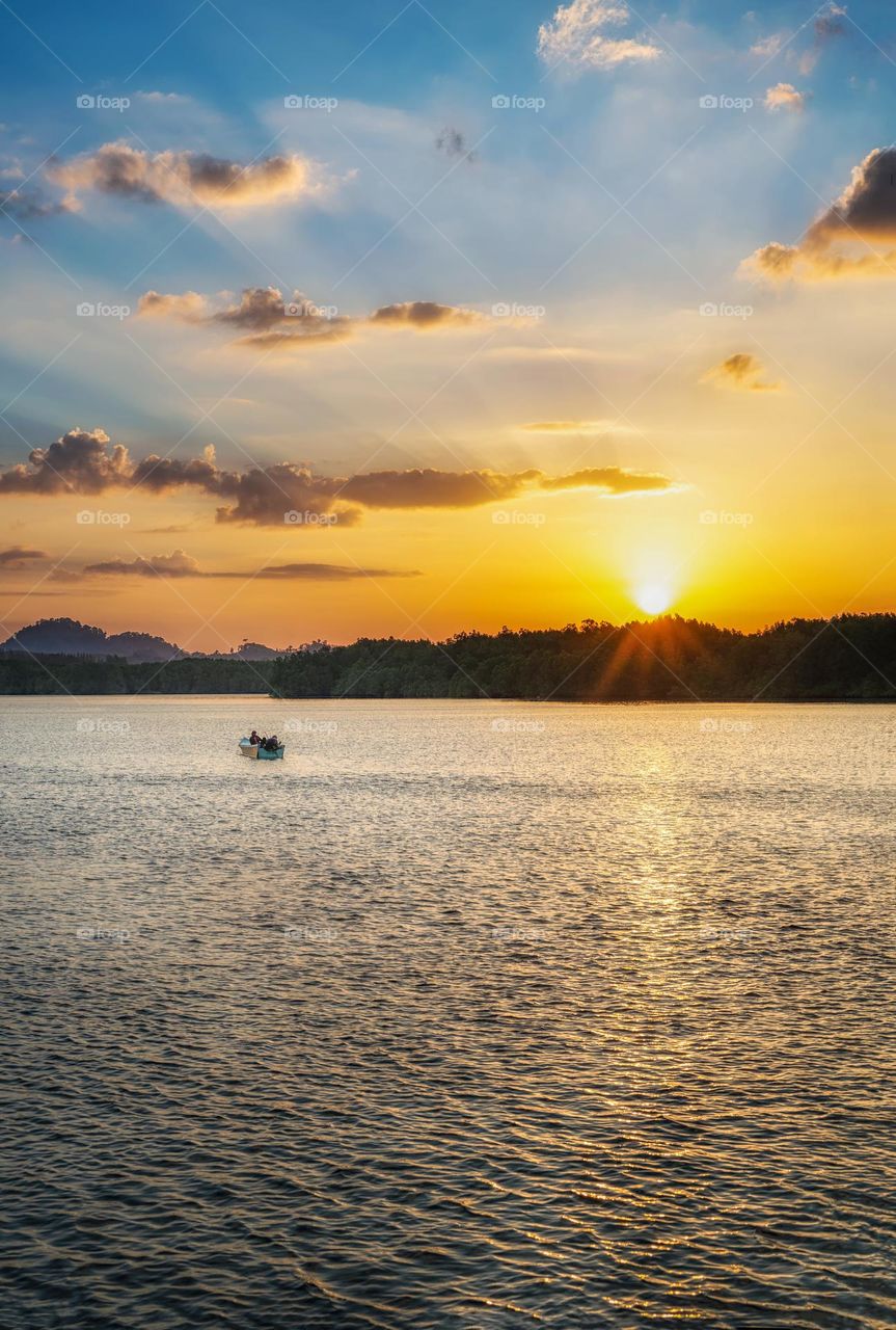 Boat and sea in sunset moment