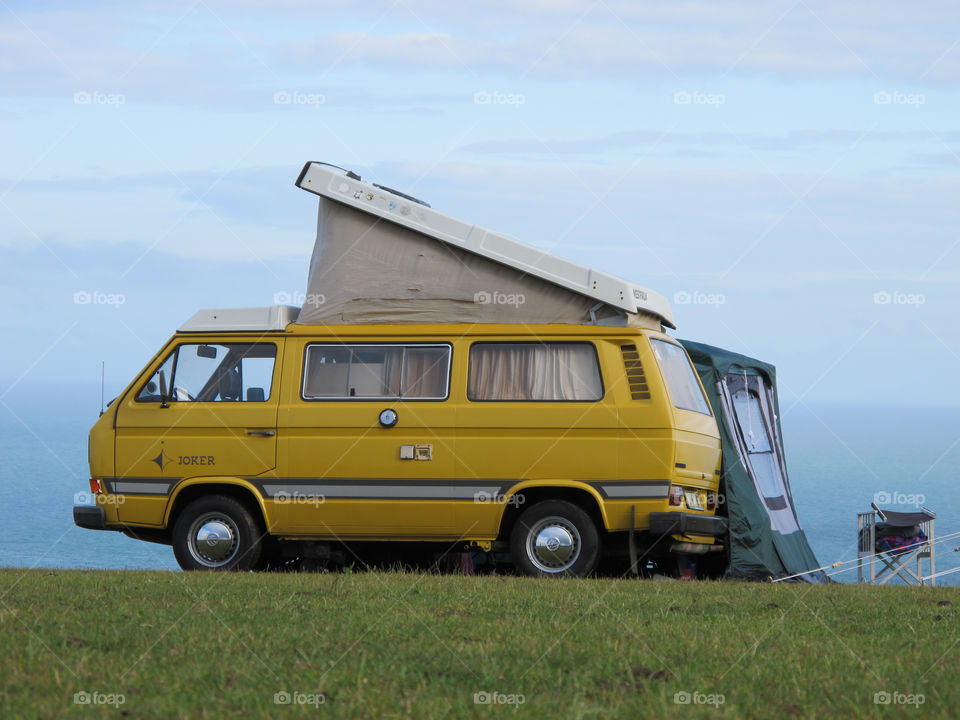 VW T25 Joker Campervan Yellow Camping with Awning on Devon Coast, East Prawle Devon England 