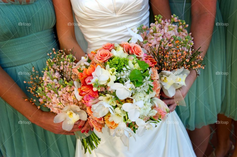 Wedding bouquets held by bride and bridesmaids