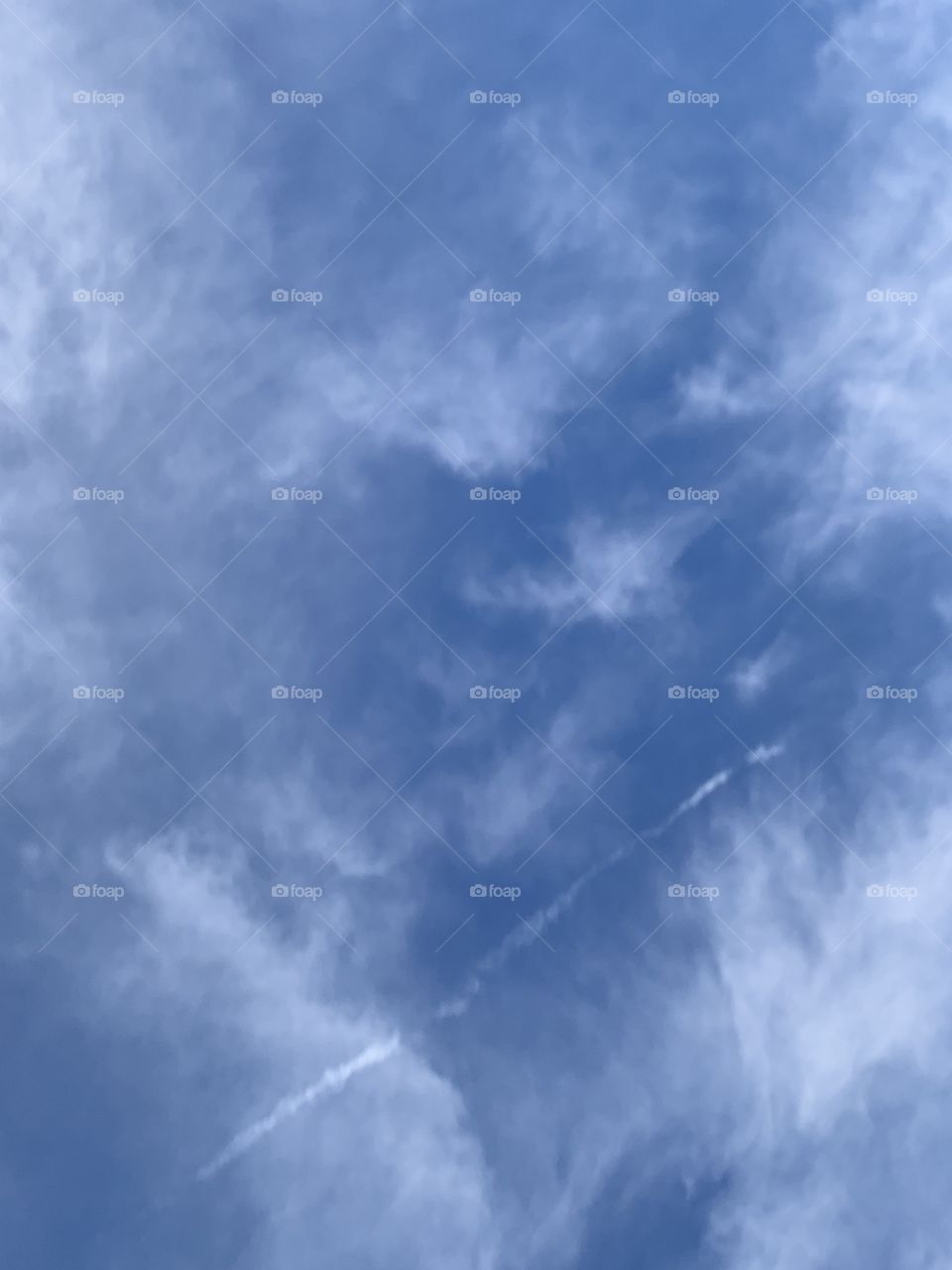 Wispy clouds on a blue sky