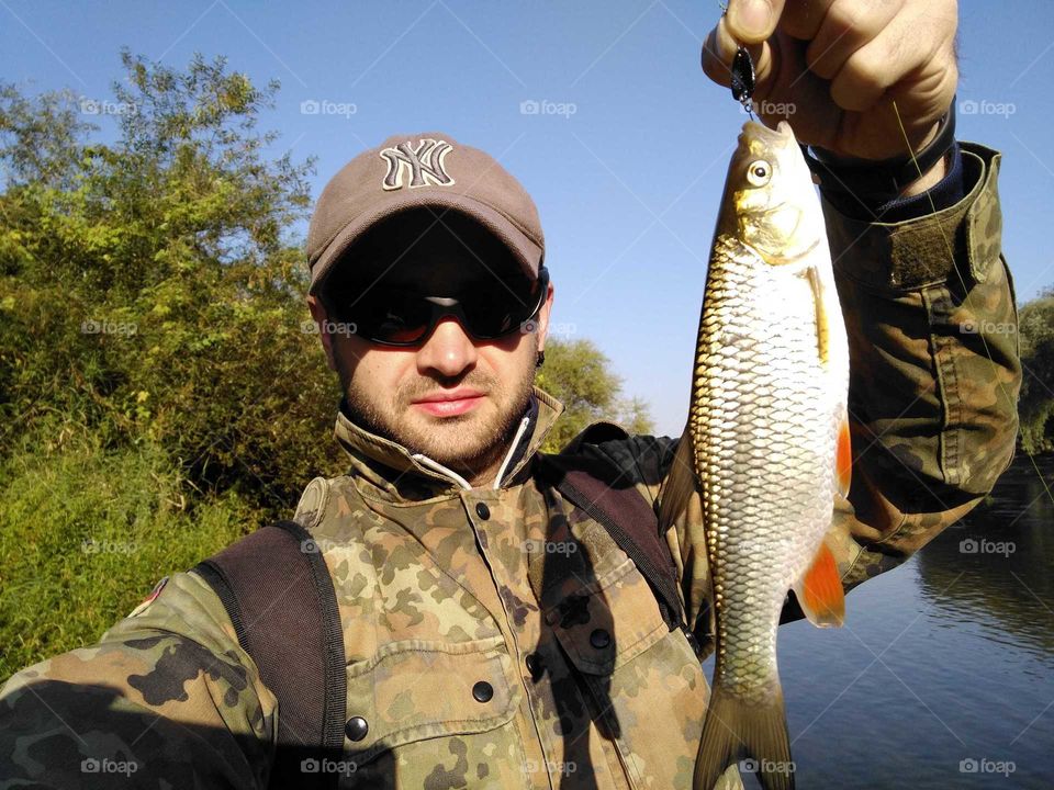 fisherman with fish