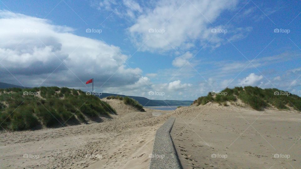 Dunes, red flag, beach, clouds