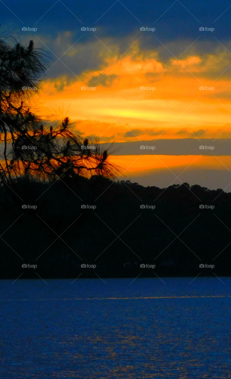 The sky was filled with the most brilliant orange complimented perfectly with hues of gold, yellow, red and crimson. An orange haze had casted over the water, reflecting off every wave.  Finally,the sun disappears along with the shine. I can only wait to see another magical moment of beauty and warmth! I can only wait for another sunset! Enjoy!