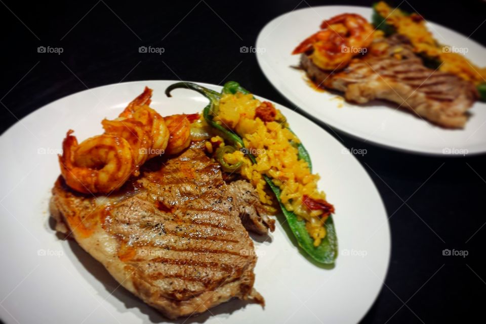surf and turf with risotto stuffed chili