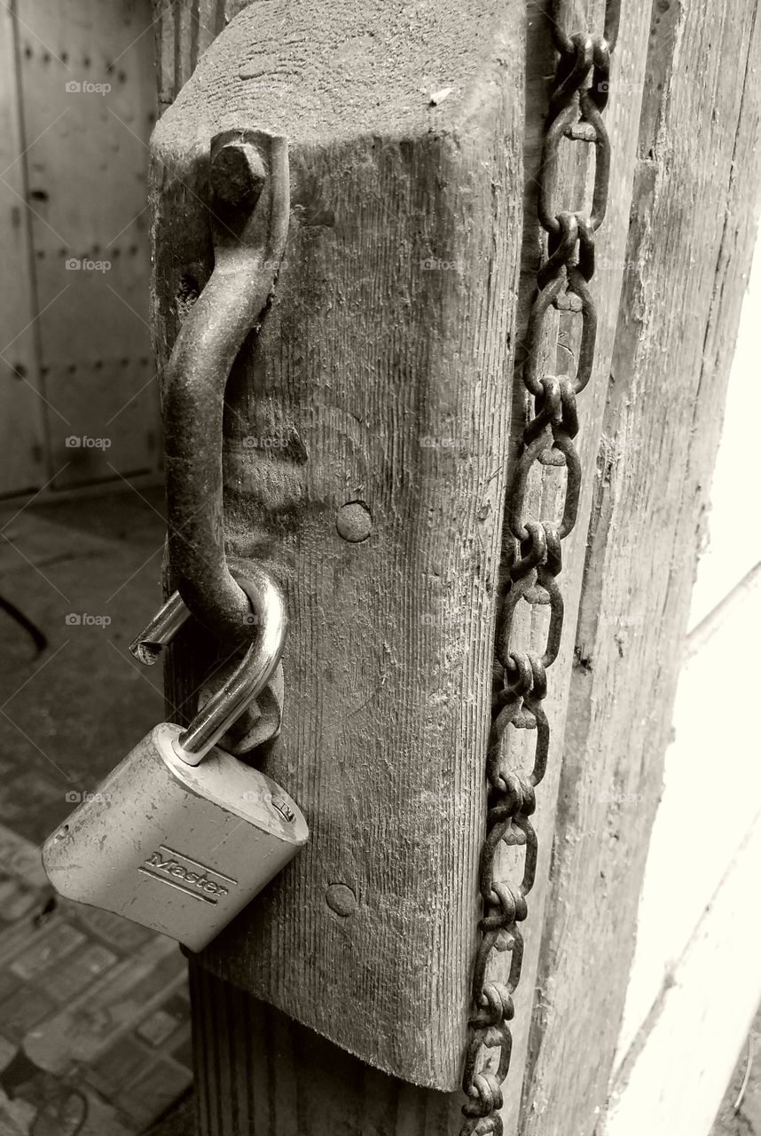 wood, chain, metal lock: black and white textures