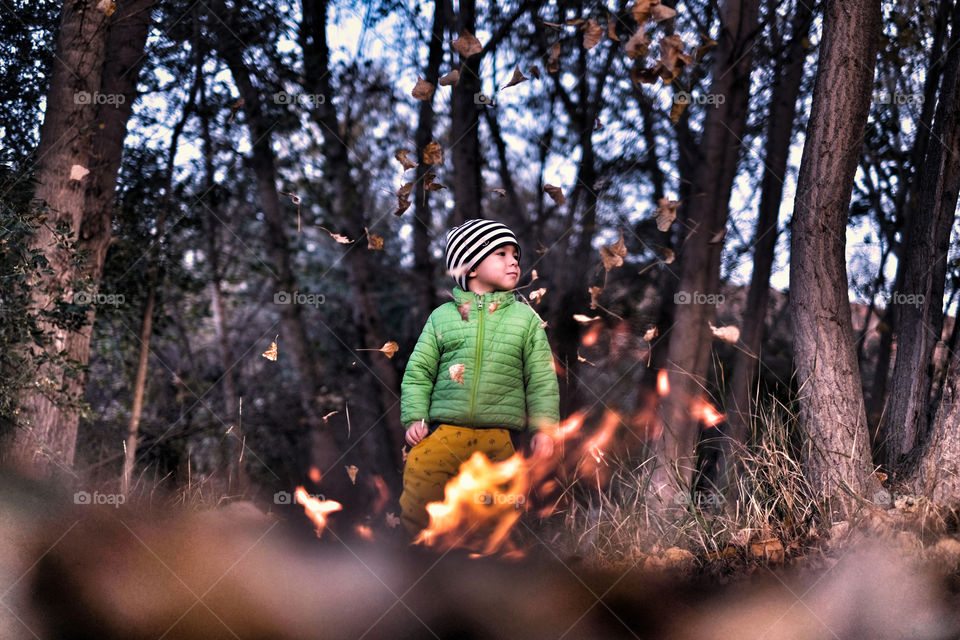 Boy behind the fire