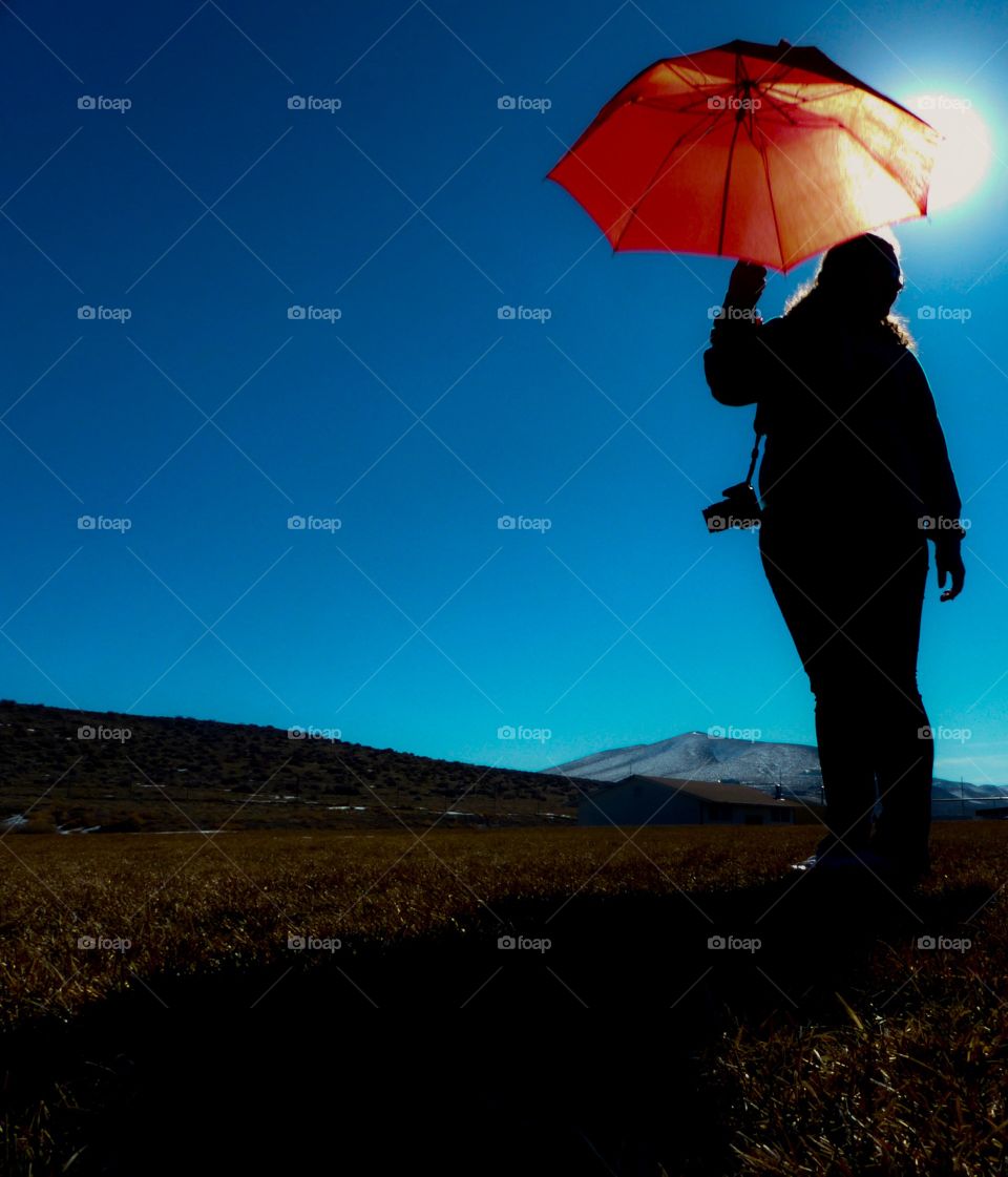 A Red Umbrella with a Silhouette