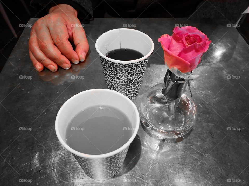 Coffee, a flower and a paw.