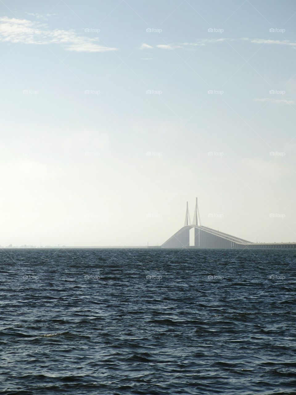 The Sunshine Skyway Bridge crossing Tampa Bay, Florida seen from the south through the morning mist