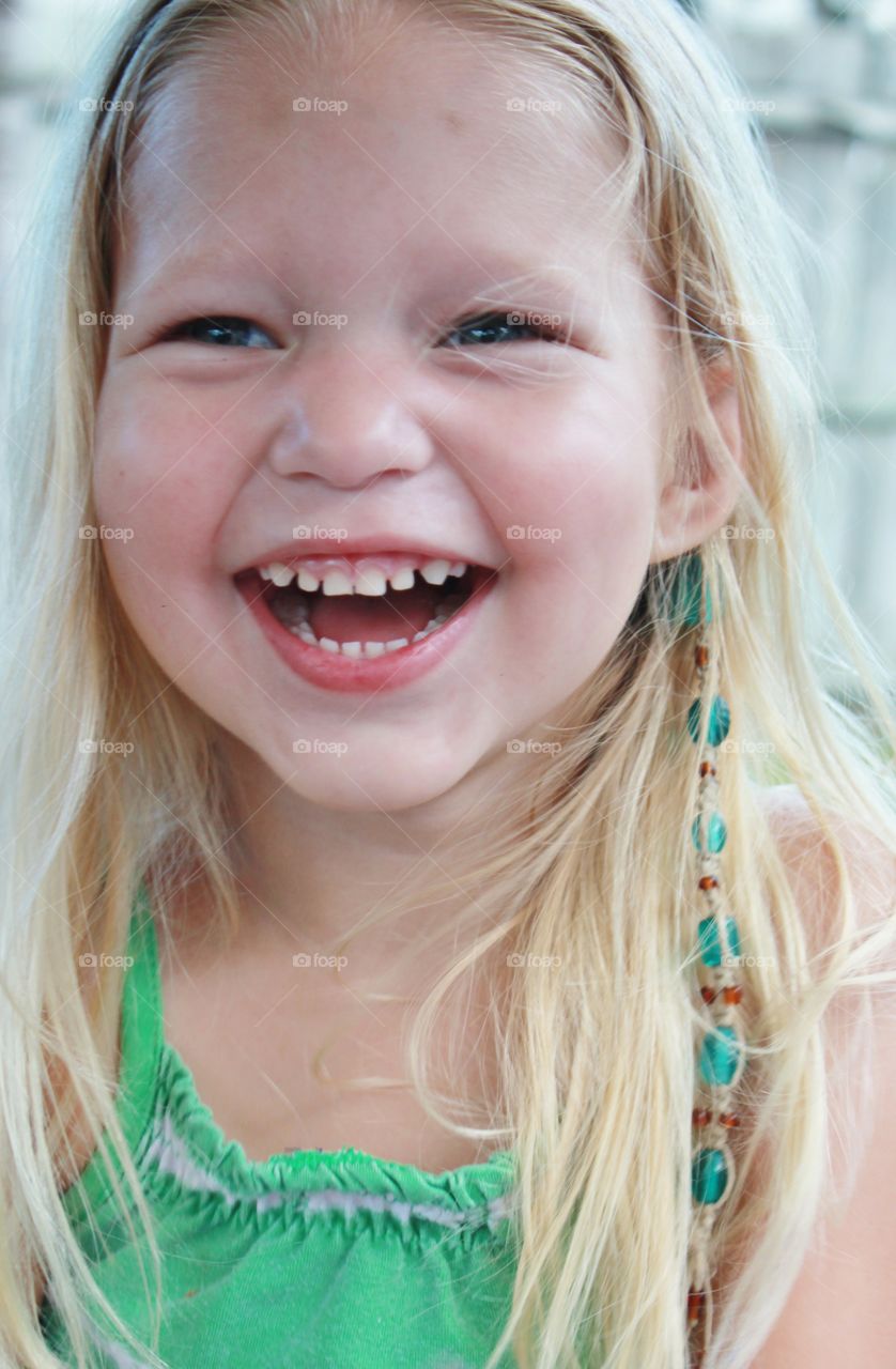 Portrait of happy blonde girl