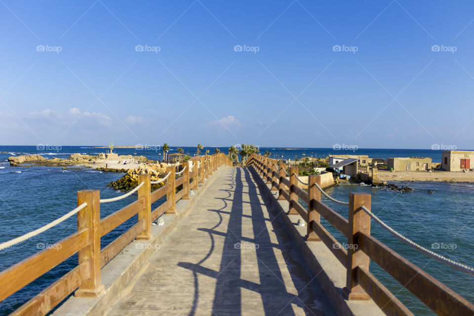 Empty wooden bridge over sea