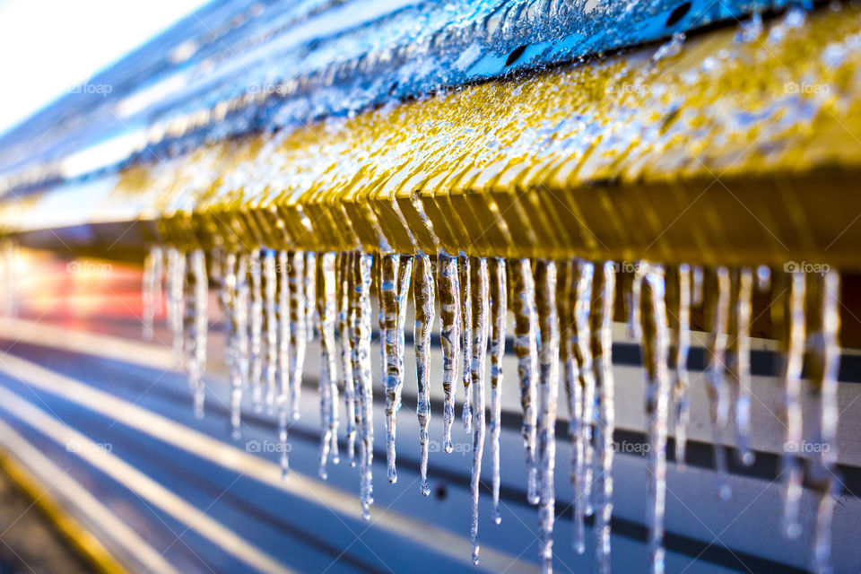 icicles hanging from the roof of the house